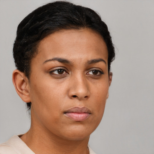Neutral black young-adult female with short  brown hair and brown eyes