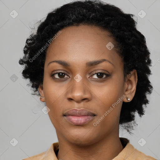 Joyful black young-adult female with long  black hair and brown eyes