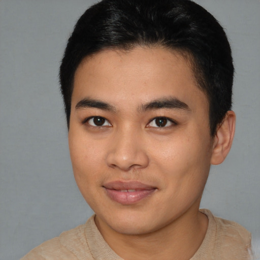 Joyful asian young-adult male with short  brown hair and brown eyes