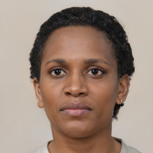 Neutral black young-adult female with short  black hair and brown eyes