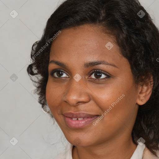 Joyful black young-adult female with medium  brown hair and brown eyes