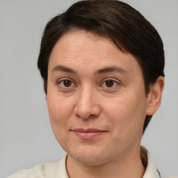 Joyful white adult female with short  brown hair and brown eyes