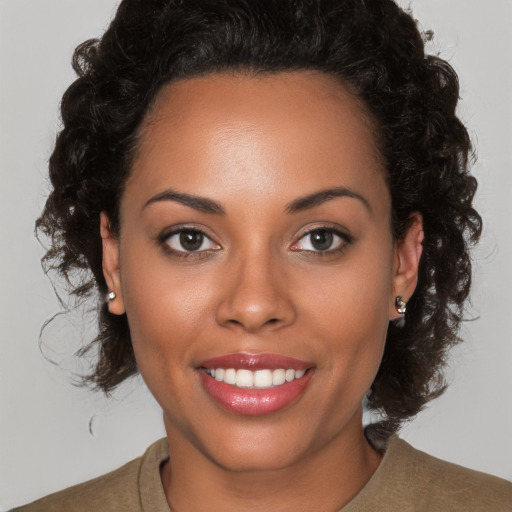 Joyful white young-adult female with medium  brown hair and brown eyes