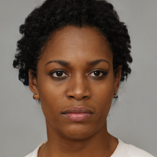 Neutral black young-adult female with short  brown hair and brown eyes