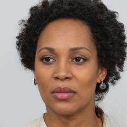 Neutral black adult female with short  brown hair and brown eyes