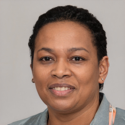 Joyful latino adult female with short  black hair and brown eyes