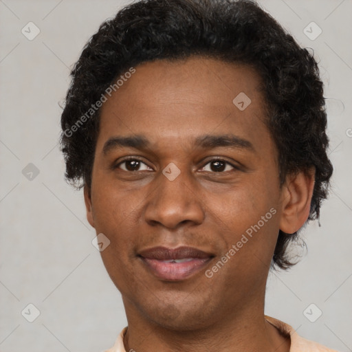 Joyful latino adult male with short  black hair and brown eyes