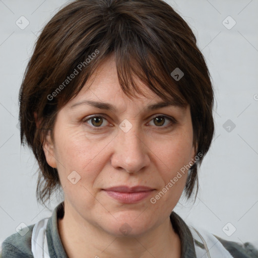 Joyful white adult female with medium  brown hair and grey eyes