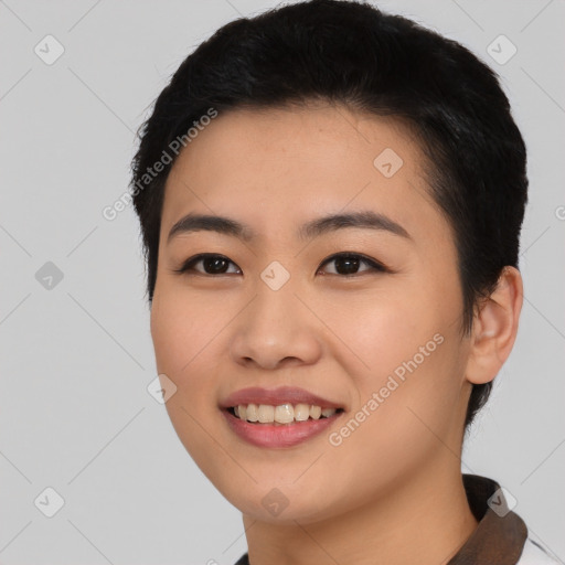 Joyful asian young-adult female with short  black hair and brown eyes