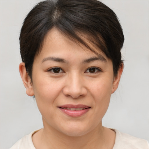 Joyful white young-adult female with medium  brown hair and brown eyes