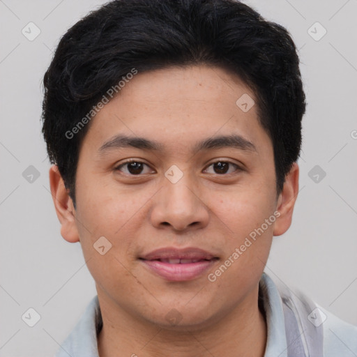 Joyful asian young-adult male with short  brown hair and brown eyes