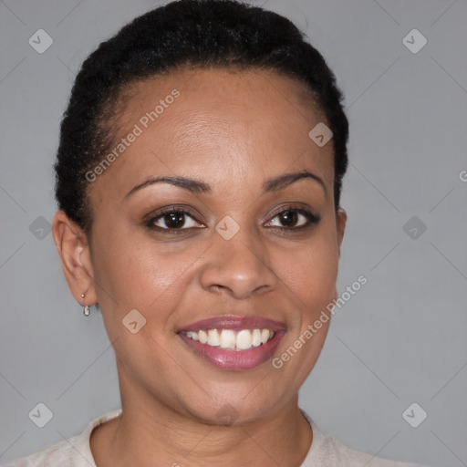 Joyful black young-adult female with short  brown hair and brown eyes