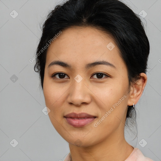 Joyful asian young-adult female with medium  black hair and brown eyes