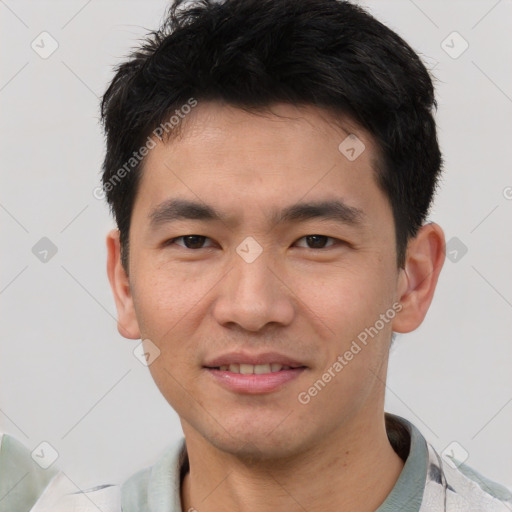 Joyful white young-adult male with short  black hair and brown eyes