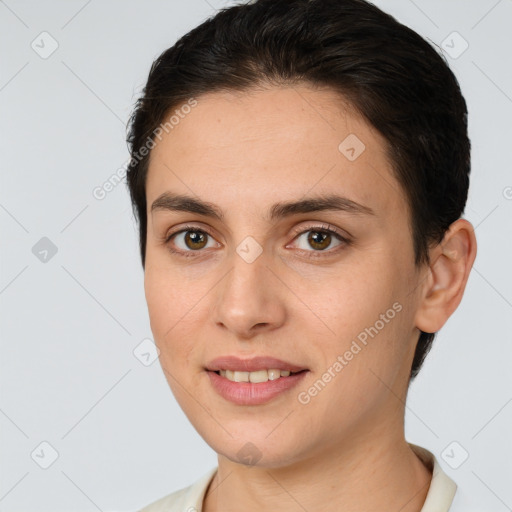 Joyful white young-adult female with short  brown hair and brown eyes