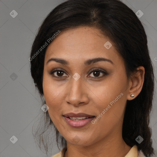 Joyful latino young-adult female with medium  brown hair and brown eyes