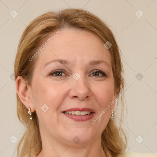 Joyful white adult female with medium  brown hair and blue eyes