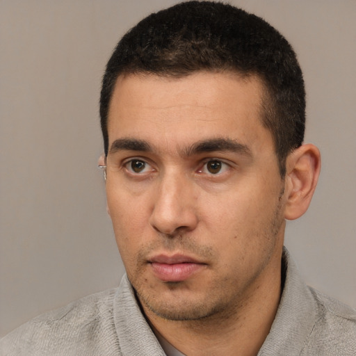 Neutral white young-adult male with short  black hair and brown eyes
