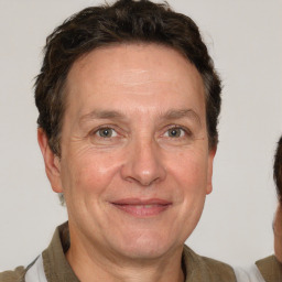 Joyful white middle-aged male with short  brown hair and brown eyes