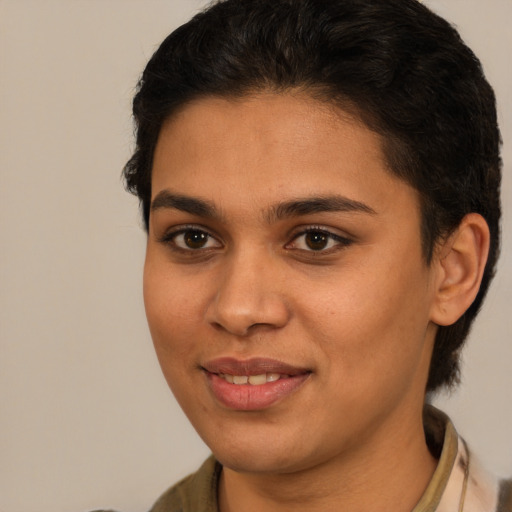 Joyful latino young-adult female with short  brown hair and brown eyes