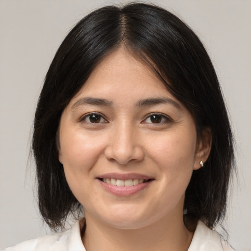 Joyful white young-adult female with medium  brown hair and brown eyes