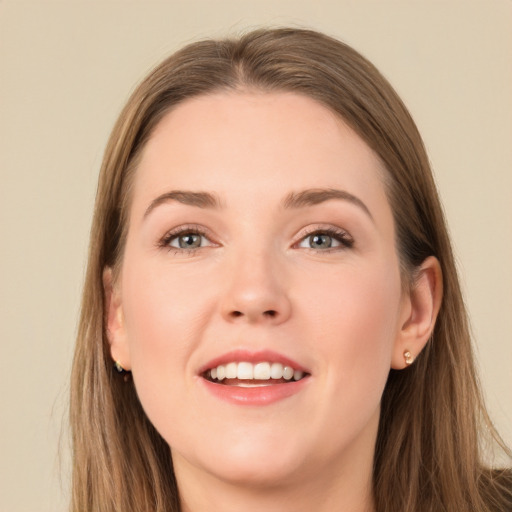 Joyful white young-adult female with long  brown hair and grey eyes