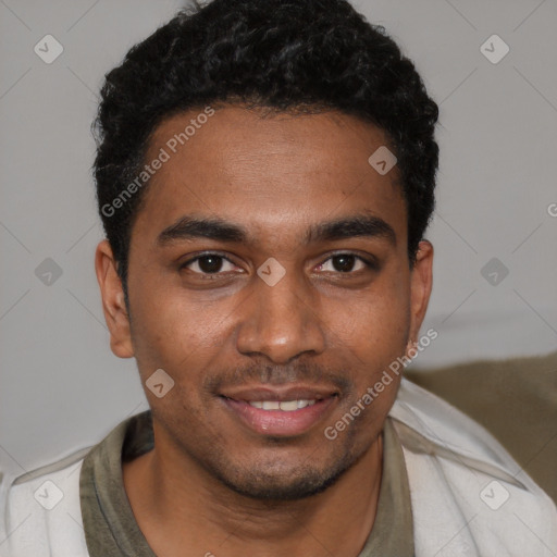 Joyful black young-adult male with short  black hair and brown eyes