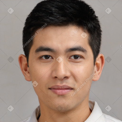 Joyful asian young-adult male with short  black hair and brown eyes