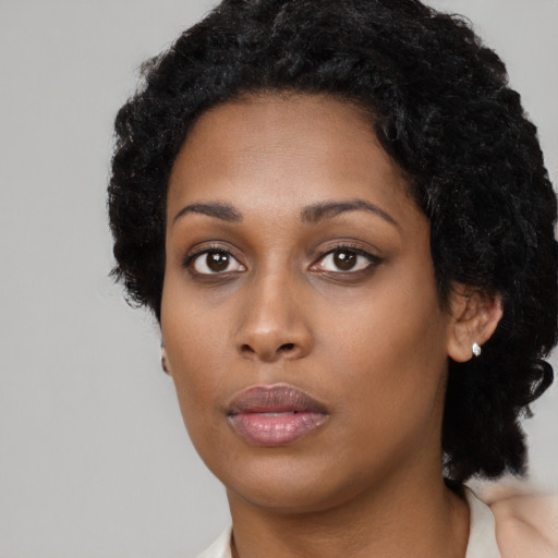 Neutral black young-adult female with long  black hair and brown eyes