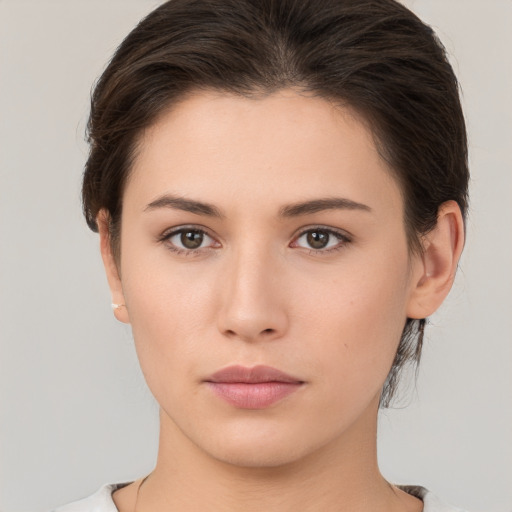 Neutral white young-adult female with medium  brown hair and brown eyes