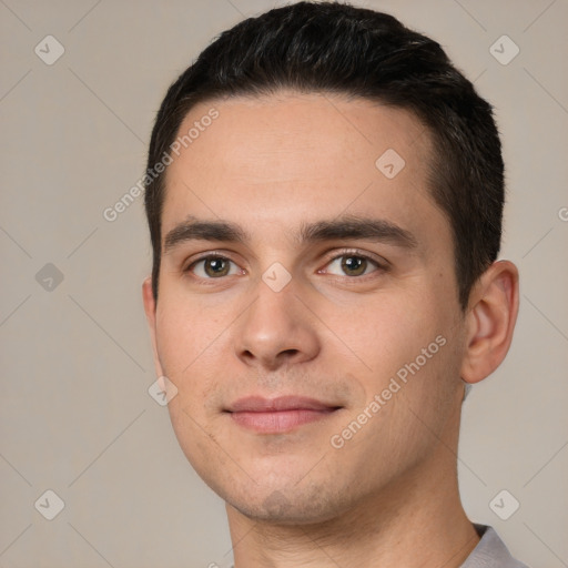 Joyful white young-adult male with short  black hair and brown eyes