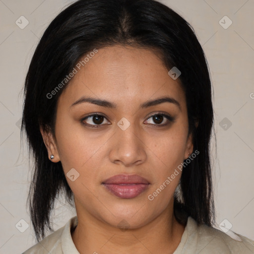 Joyful latino young-adult female with medium  brown hair and brown eyes