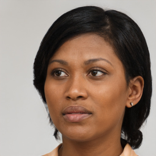 Neutral black young-adult female with medium  black hair and brown eyes