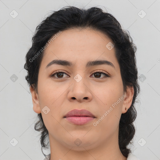 Joyful latino young-adult female with medium  brown hair and brown eyes