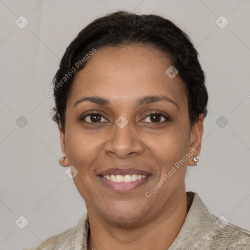 Joyful latino adult female with short  brown hair and brown eyes