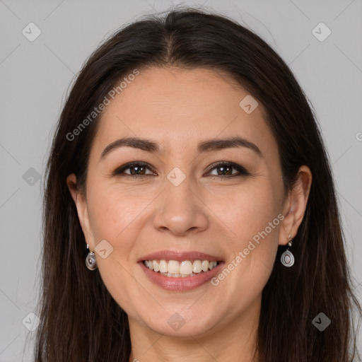 Joyful white young-adult female with long  brown hair and brown eyes