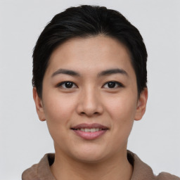 Joyful asian young-adult female with short  brown hair and brown eyes