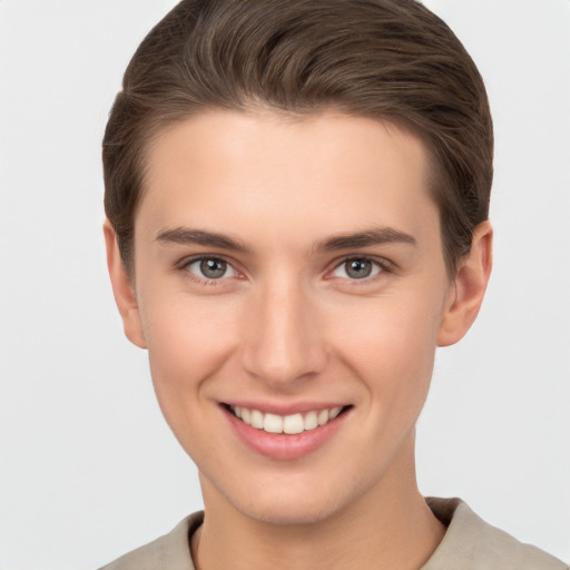 Joyful white young-adult female with short  brown hair and brown eyes