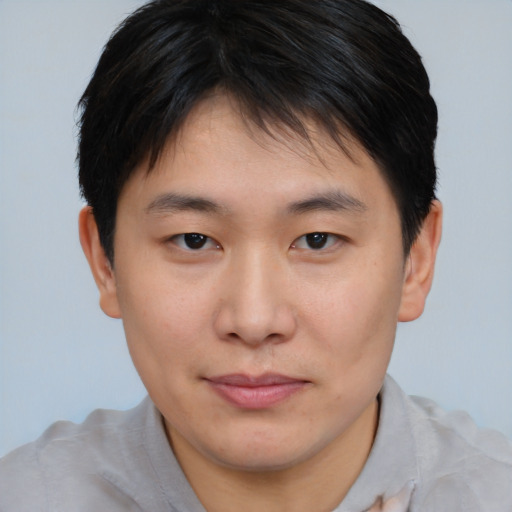 Neutral asian young-adult male with short  brown hair and brown eyes