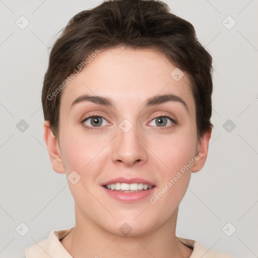 Joyful white young-adult female with short  brown hair and grey eyes