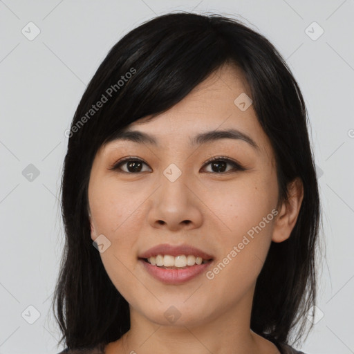 Joyful asian young-adult female with medium  black hair and brown eyes