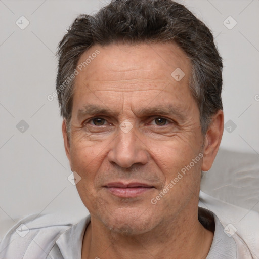 Joyful white middle-aged male with short  brown hair and brown eyes