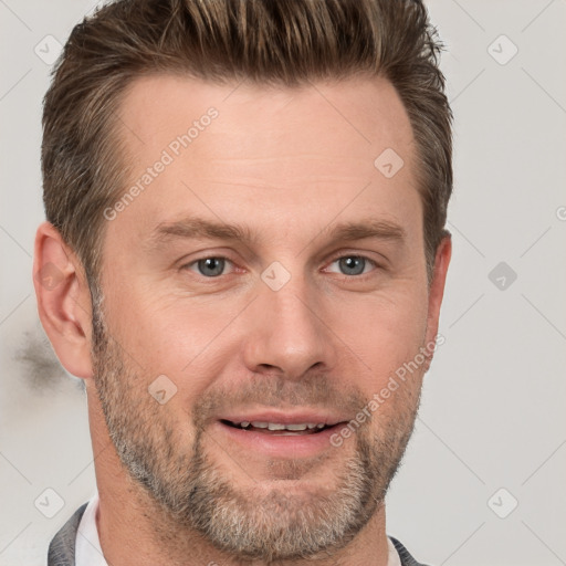 Joyful white adult male with short  brown hair and grey eyes