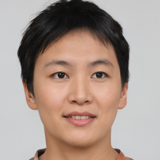 Joyful asian young-adult female with short  brown hair and brown eyes