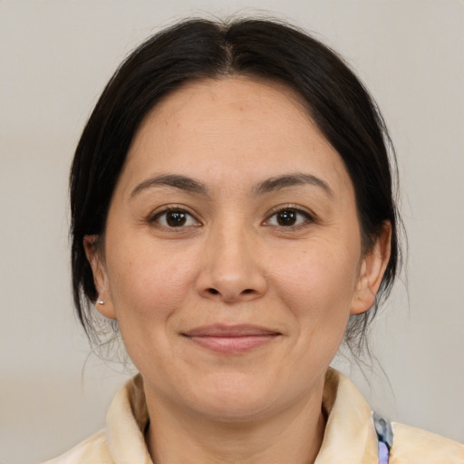 Joyful white adult female with medium  brown hair and brown eyes