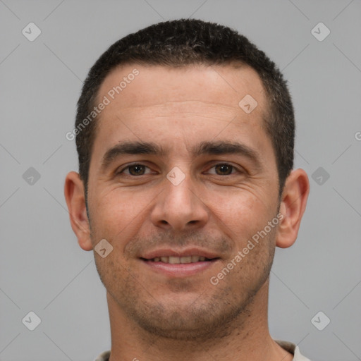 Joyful white young-adult male with short  brown hair and brown eyes