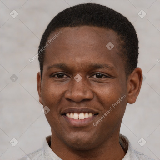 Joyful latino young-adult male with short  brown hair and brown eyes