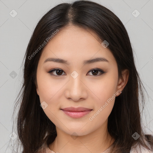 Joyful asian young-adult female with long  brown hair and brown eyes