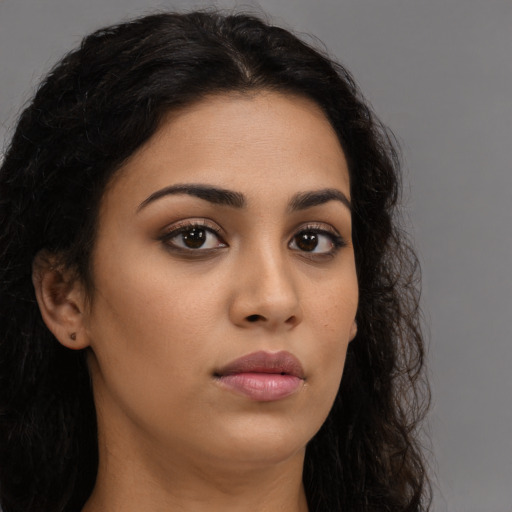 Neutral latino young-adult female with long  brown hair and brown eyes