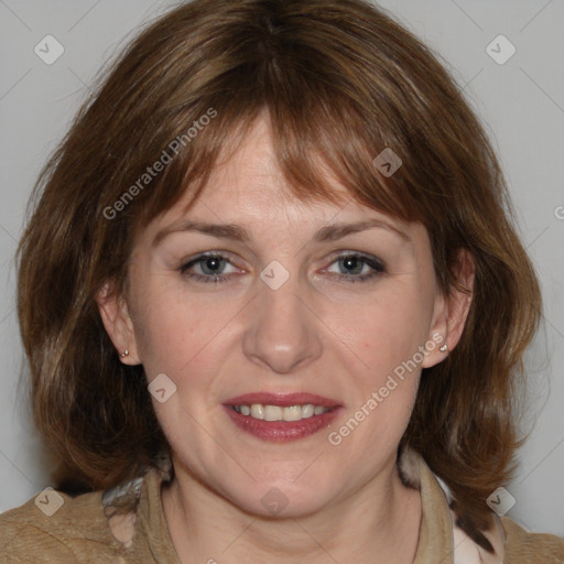 Joyful white adult female with medium  brown hair and grey eyes